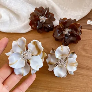 Elegant acrylic crystal beaded flower stud earrings in marble white and brown tones