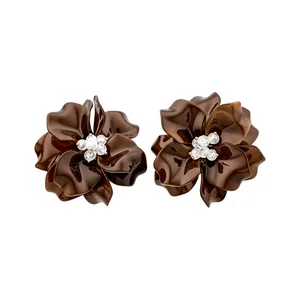 Elegant dark brown glossy acrylic flower stud earrings with sparkling crystal center