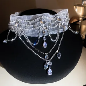 Close-up of luxury French retro lace choker with sparkling crystal flower tassels