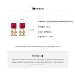 Detailed info card showing dimensions and material specs for vintage resin earrings