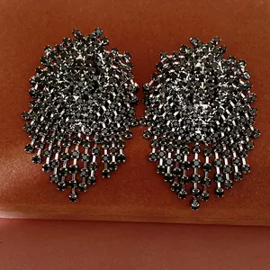 Detailed view showing the intricate black rhinestone fringe on these elegant earrings.