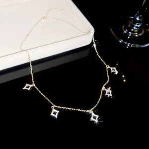Detailed view of exquisite 18K gold plated necklace featuring five sparkling CZ star-shaped charms