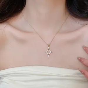 Elegant close-up of a gold-plated necklace featuring a sparkling zircon star pendant