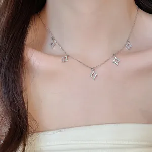 Detail shot of elegant zircon star pendant necklace worn by a model, luxury style