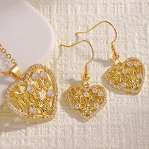 Macro detail of the gold heart Mama jewelry set featuring sparkling cubic zirconia.