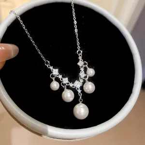 Detailed view of French vintage silver necklace with white pearls and sparkling zircons