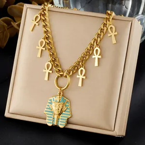 Detailed view of gold Egyptian Pharaoh pendant necklace with blue enamel and Ankh charms