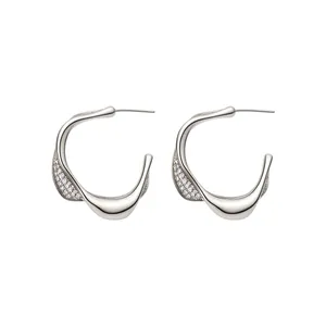 Elegant silver irregular U-shaped hoop earrings with minimalist cubic zirconia pave