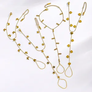 Detailed view of four gold stainless steel slave bracelets with butterfly and heart charms.