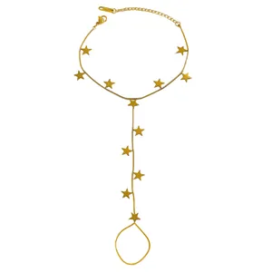 Detailed view of a gold stainless steel finger bracelet featuring multiple star charms.