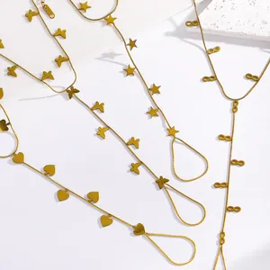 Detail view of stainless steel finger bracelets with star, heart, and butterfly charms.