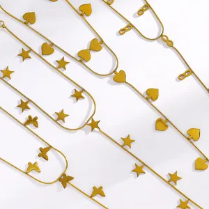 Detailed view of gold stainless steel hand chains with star and butterfly charms