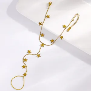Elegant gold stainless steel hand chain featuring star charms and finger ring detail