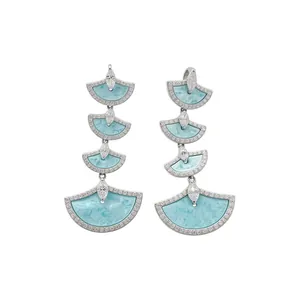 Luxurious silver fan-shaped drop earrings with light blue inlay and sparkling zircons
