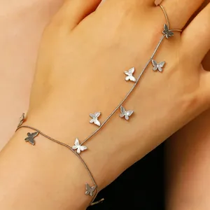 Detailed view of a stylish stainless steel butterfly hand harness bracelet on a hand