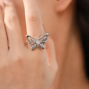 Detailed view of an elegant silver butterfly ring featuring a sparkling central zircon stone