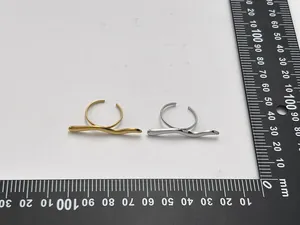 Minimalist curved open rings shown with ruler for size measurement and scale detail