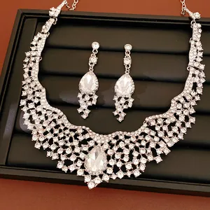 Detail view of luxury rhinestone teardrop necklace and earring set in royal style