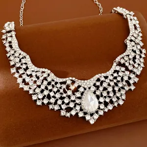 Intricate floral rhinestone necklace featuring a large pear-shaped crystal drop