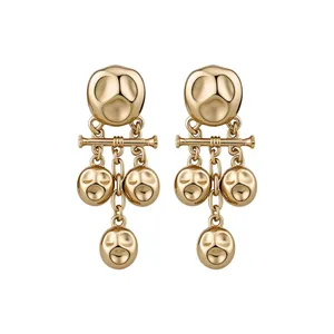 Vintage gold hammered metal tassel drop earrings featuring a pleated texture and stud back
