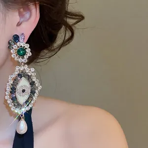 Elegant French vintage evil eye drop earrings with sparkling rhinestones and pearl