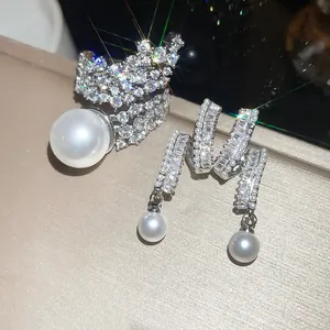Elegant luxury jewelry set featuring sparkling zircon and white pearl ring and earrings