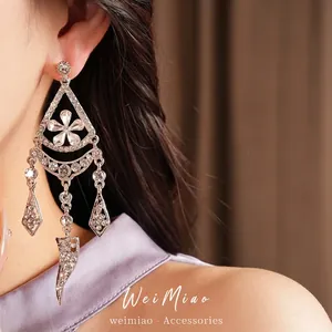 Elegant silver-toned flower tassel earrings with sparkling rhinestones for a luxury look