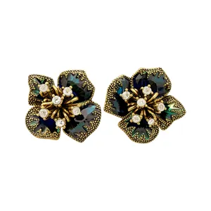 Elegant vintage golden flower earrings with deep blue resin petals and crystal accents