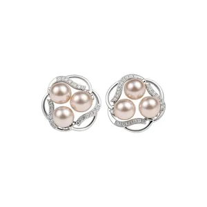 Elegant silver flower stud earrings featuring three pale pink pearls and shiny zircons