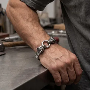 Vintage steel men's bracelet featuring double wolf heads and thick woven chain
