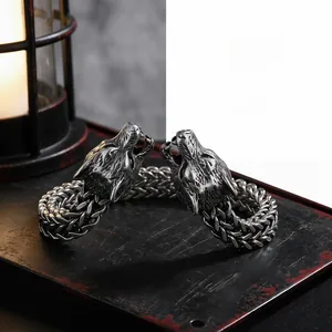 Detailed view of dual wolf heads and metal braided texture with vintage distressed finish