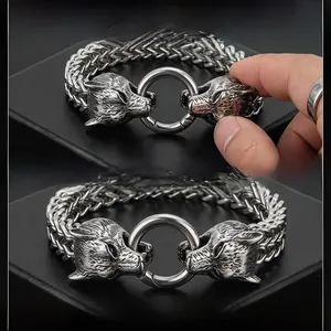 Detail of Viking wolf head buckle with heavy wheat chain and spring ring clasp