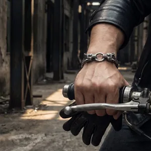 Close-up of a double wolf head titanium steel bracelet on a biker wrist