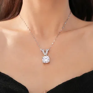 Minimalist silver necklace featuring a V-shaped pendant set with a large round zircon stone