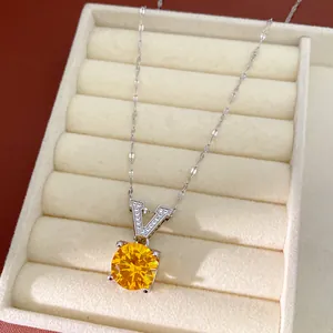 Elegant silver V-letter pendant necklace with round yellow zircon gemstone in beige box