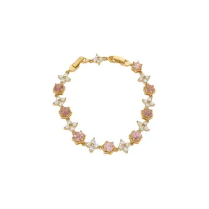 Elegant 18k gold plated bracelet adorned with pink zircons and sparkling stone flowers