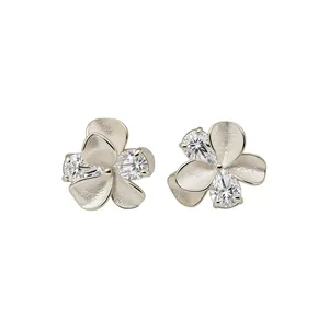 Elegant silver flower stud earrings with sparkling zircons and textured petals design
