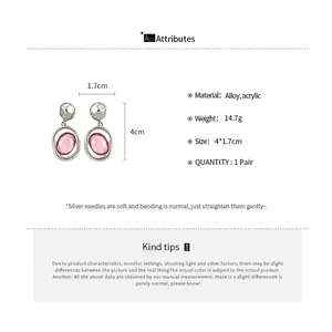 Technical detail view of pink oval acrylic pendant earrings with size measurements.