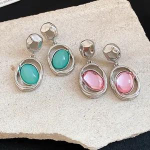 Detailed view of French vintage oval acrylic pendant earrings with elegant silver finish