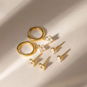 Detailed view of 18K gold plated clover earrings set with zircon