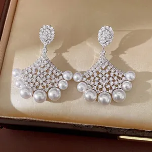 Elegant 18K gold plated fan-shaped drop earrings featuring zircons and white pearls