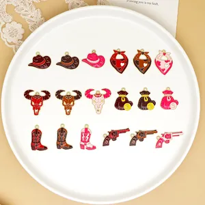 Detailed view of colorful Western cowboy enamel charms on a white decorative plate