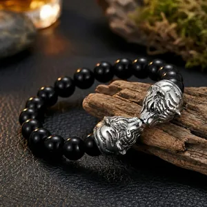 Bracelet pour homme avec têtes de tigre, perles noires et acier au titane
