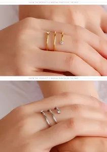 Detail view of minimalist stainless steel spiral ring with sparkling zircons
