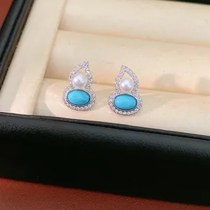 Elegant gourd-shaped pearl and turquoise stud earrings with zircon inlay in a display box