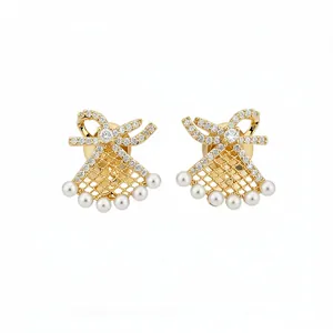 Elegant gold-plated bow and fan-shaped earrings with pearls and micro-pave crystals