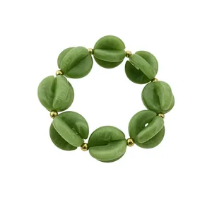 Pulsera bohemia de cuentas de acrílico verde jaspeado y detalles dorados