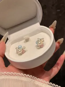 Exquisite cluster pearl grape earrings with bow detail inside a white gift box.