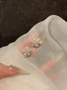 Charming grape cluster stud earrings with colorful pearls and shimmering beads.