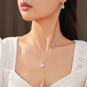 Detailed close-up shot of an elegant pearl and zircon flower necklace on an Asian model